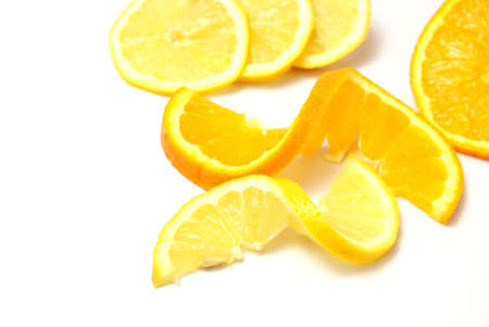 Twists of lemon and orange on white backgroundの写真素材