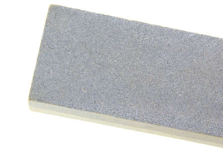 Knife sharpening stone on whiteの写真素材