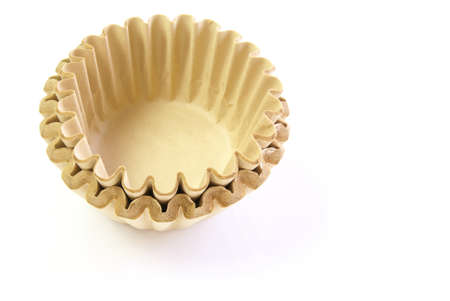 Brown coffee filters, unbleached and natural on a white backgroundの写真素材