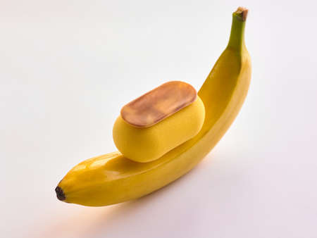 banana dessert with chocolate on a white backgroundの写真素材