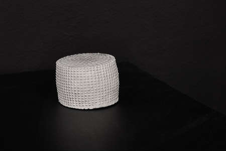 cheese head on a dark background