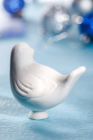 ceramic bird on a bright backgroundの写真素材