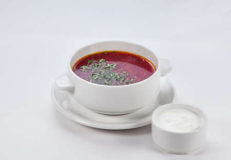 borscht in a plate on a white backgroundの写真素材