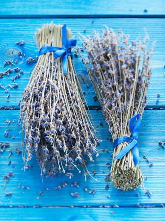 two bouquets of lavender on a blue background