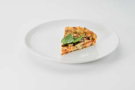 pie with fish and greens on a white backgroundの写真素材