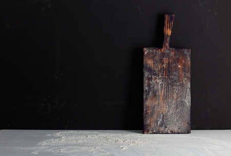 cutting Board in flour on a black background
