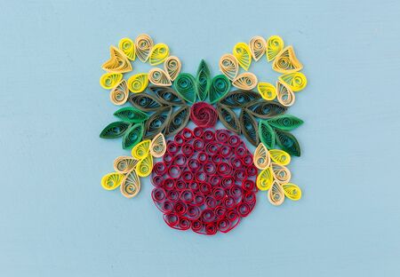 Christmas quiling decoration elements on blue board for background compositionの写真素材