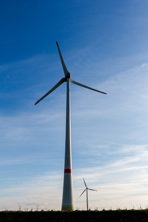Wind turbine in germany over blue skyの写真素材