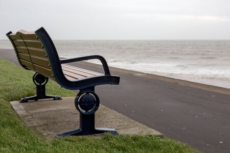 Bench at walk path over sea