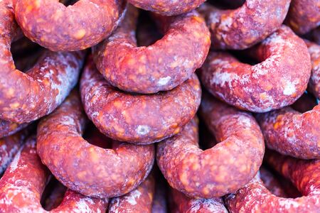 Traditional home madechorizo for sale on local food market close up shot
