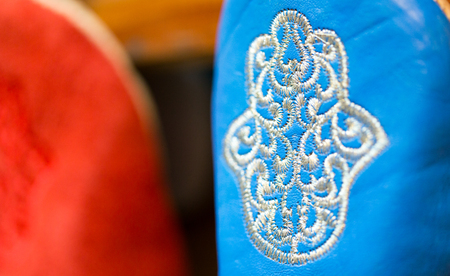 Colors of Marrakesh on sophisticated handmade traditional leather slippers at old medina souk, Moroccoの写真素材