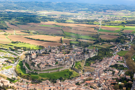 Aerial view from top on medieval village, Carcassoonne in France in spring season. Full frame horizontal crop with tourist attraction in centreの写真素材