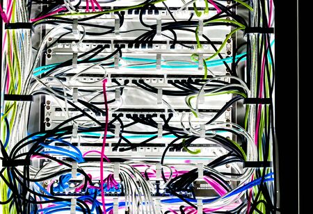 Server room Internet connected servers with multi cables and workstations.の写真素材