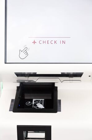 Self service check in machine kiosk on airport. Close up crop. Vertical orientation with white space