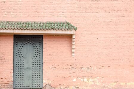 Old traditional islamic door in Moroccan buildings. Straight direct front view.の写真素材