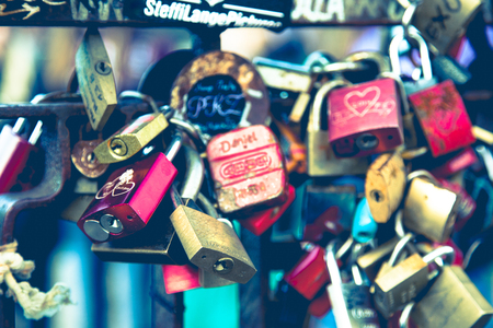 Metal colorful lockers connected to metal fence. Close up full frame horizontal crop.のeditorial素材