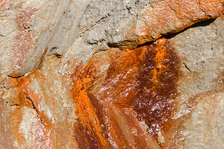 Hard rusty rock profile background. Close up detailed full frame crop