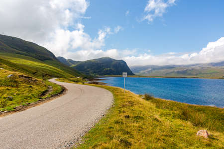 Single wavy, serpentine road in North Coast 500, Scotlandの写真素材
