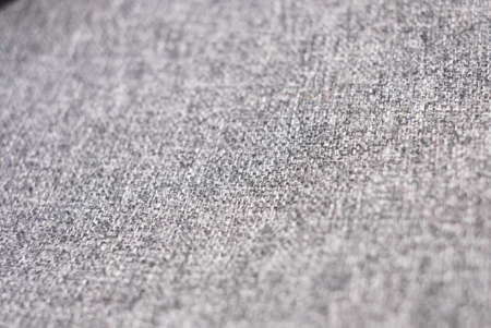 Closeup elective focus of grey fabric texture. Grey linen texture background.の写真素材
