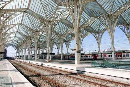 The Oriente Train Station (Gare do Oriente) in Lisbon,Portugal designed by famous architect  Santiago Calatrava, built in 1998. Train station with train stop in the front.のeditorial素材
