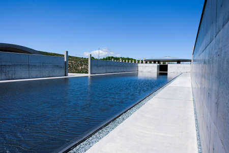 Hill of the buddha in Hokkaido,Japan designed by Tadao Ando with nice blue sky and reflecting pondのeditorial素材