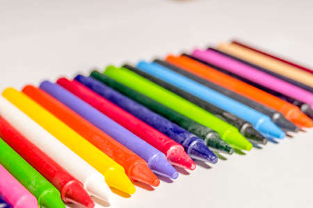 Colorful group of crayons/color pencil laying on the table.の写真素材