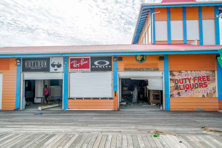Philipsburg Sint maarten: Board walk and buildings completely covered with beach sand and debris after island got hit by hurricane Irma.のeditorial素材
