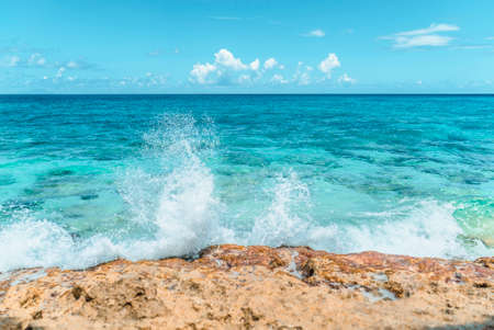 Blue sea water clashing on beautiful beach coast.の写真素材