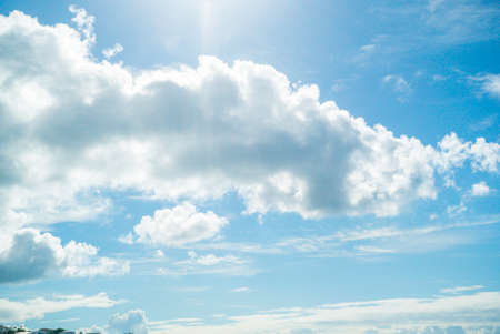 Beautiful white cloudy sky with the sun rising.の写真素材