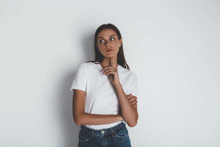 Front view of young woman in jeans and blank white t-shirt