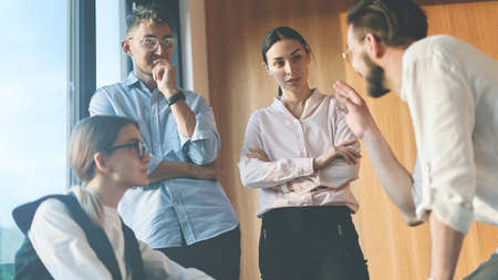 Portrait of young coworkers talking during a break at workの写真素材