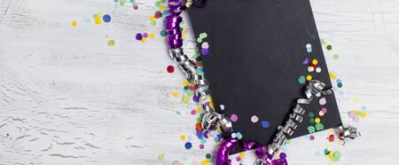 carnival confetti on wood backgroundの写真素材