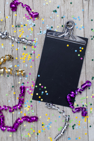 carnival confetti on wood backgroundの写真素材