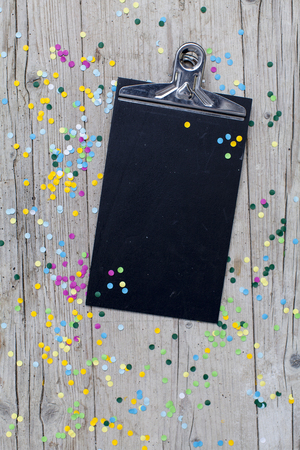 carnival confetti on wood backgroundの写真素材