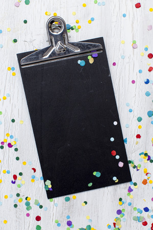 carnival confetti on wood backgroundの写真素材