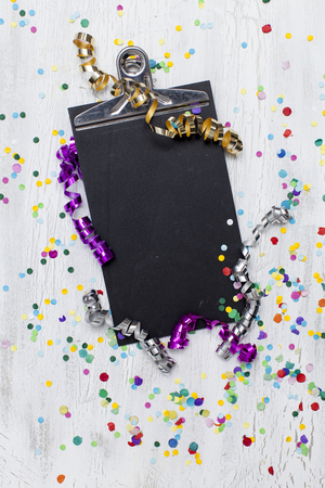 carnival confetti on wood backgroundの写真素材