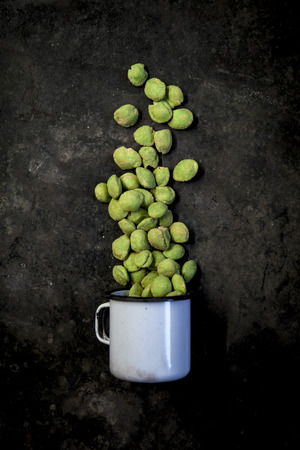 wasabi peanuts on black backgroundの写真素材