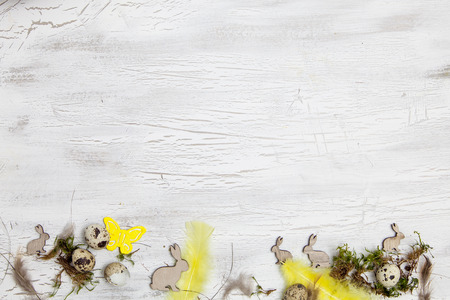 easter decoration with Easter eggs on white wood backgroundの写真素材