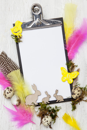 easter decoration with Easter eggs on white wood backgroundの写真素材