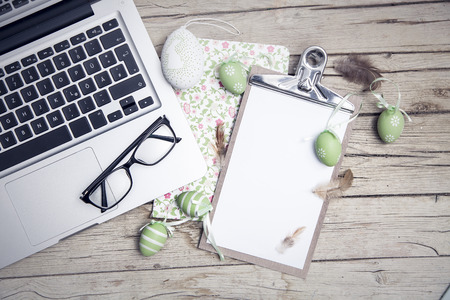 easter background with eastereggs and butterflies on woodの写真素材