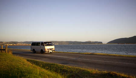 Mini bus taxi / tour operator traveling along a scenic road Knysna, South Africaのeditorial素材