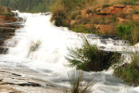 Water cascading down a series rocks.の写真素材