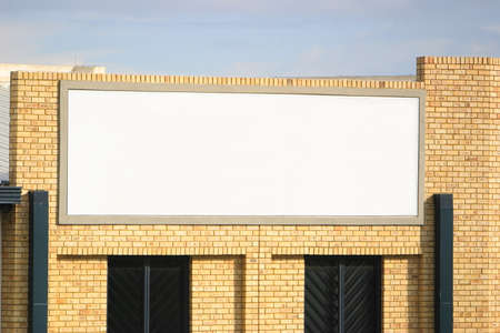 Blank sign on a factory wall.の写真素材
