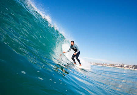 Surfer On Blue Ocean Wave