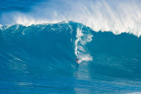 MAUI, HI - MARCH 13: Professional surfer Laird Hamilton rides a giant wave at the legendary big wave...