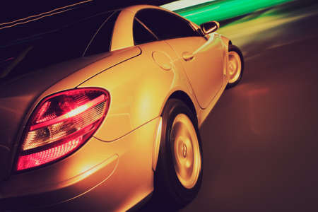 Fancy Sports Car on Road in Motionの写真素材