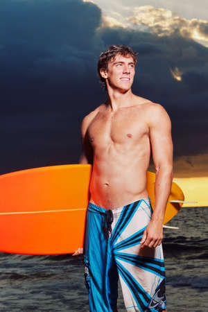 Professional Surfer holding a Surf Boardの写真素材