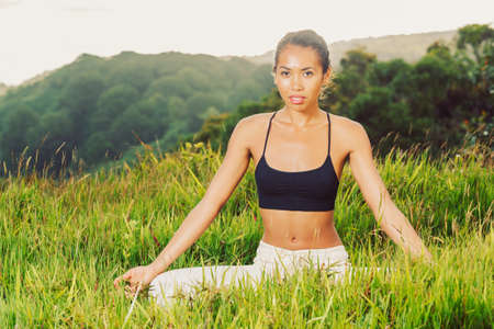 yoga woman outside in natureの写真素材