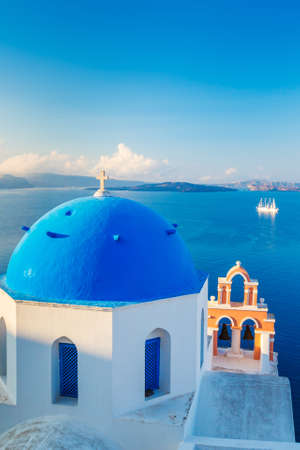 Santorini Island, Greece, Beautiful View of Blue Ocean and Traditional Dome Church Architecture の写真素材