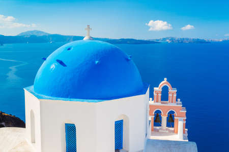 Santorini Island, Greece, Beautiful View of Blue Ocean and Traditional Dome Church Architecture の写真素材
